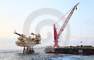 Offshore construction platform for production oil and gas. Oil and gas industry and hard work. Production platform and operation