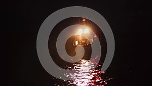 Offshore crewboat during night crewchange on offshore oilfield.