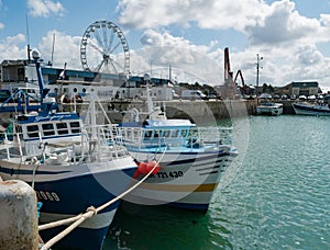 Offshore fishing boats in the commercial harbor and port of Granville on the Normandy coast