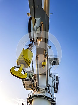 Offshore heavy lift crane at sea by night knuckle jib