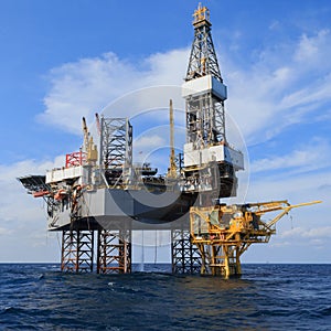 Offshore Jack Up Drilling Rig Over The Production Platform