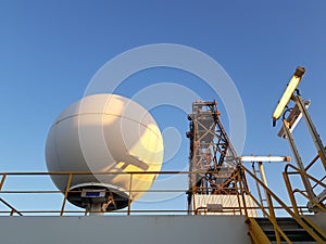 Offshore oil and gas drill rig with satellite equipment