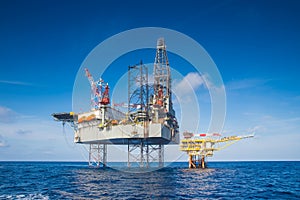 Offshore oil and gas drilling rig in the gulf of Thailand while completion gas and crude oil reservoir at wellhead remote platform