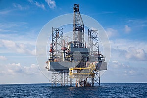Offshore oil and gas drilling rig at the gulf of Thailand whil compleation on wellhead remote platform