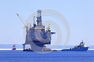 Offshore oil and gas platform with supply ships