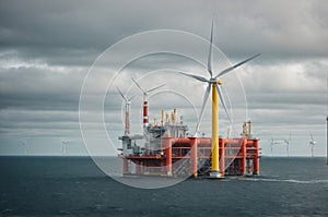 Offshore oil and gas production petroleum pipeline and wind turbine in the sea