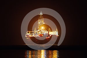 Offshore oil platform at night