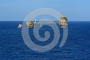 The offshore oil rig and supply boat