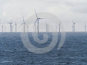 Offshore and Onshore Windmill farm Westermeerwind, Windmill park in the Netherlands with huge large wind turbines, group of