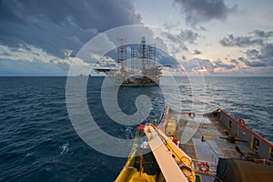 An offshore vessel during towing operation of an oil platform