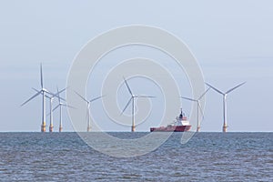 Offshore wind farm turbines with maintenance supply vessel ship