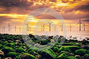 Offshore Wind Turbine in a Wind farm at sunset in Redcar, Yorkshire, UK