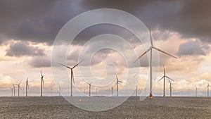 Offshore Windfarm at sea under cloudy sky