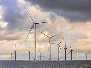 Offshore Windfarm at sea under cloudy sky