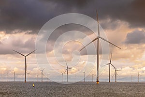 Offshore Windfarm at sea under cloudy sky