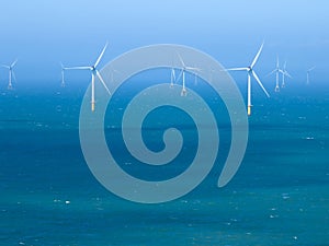 Offshore Windmill farm in the ocean