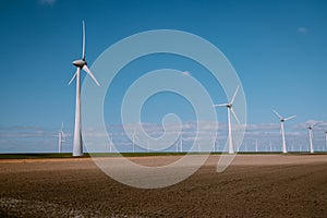 Offshore Windmill farm in the ocean Westermeerwind park , windmills isolated at sea on a beautiful bright day