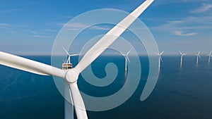 Huge windmill turbines, Offshore Windmill farm in the ocean Westermeerwind park , windmills isolated at sea on a