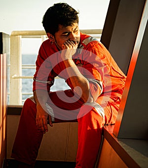 Offshore worker resting at bridge