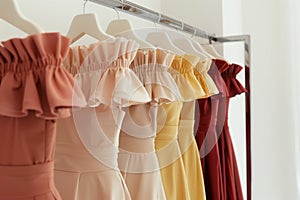 offtheshoulder dresses lined up on a sleek rack