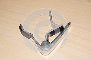 Crushers or `capo` - Small accessory for stringed instruments