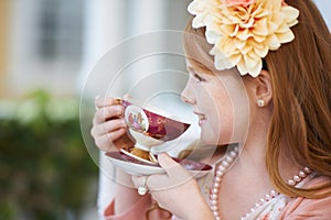 Oh I love my tea time. A little girl playing dress up and having a tea party in her garden.