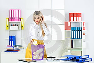 Oh my god. Woman search crumpled paper in basket. ceo in messy office. throw garbage into paper container. woman hold