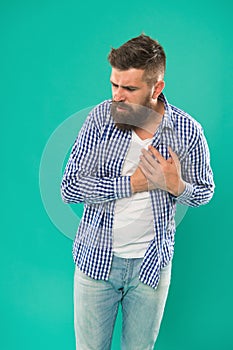 Oh my heart. Bearded man suffer from heart pain. Hipster hold hand on heart. Cardiovascular health. Heartache and chest