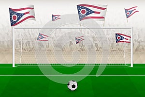 Ohio football team fans with flags of Ohio cheering on stadium, penalty kick concept in a soccer match