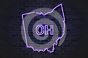 Ohio map glowing neon lamp or glass tube on a black brick wall