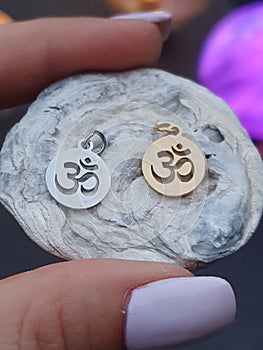 Ohm symbol necklace on ocean slice photo