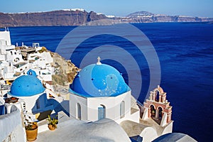 Oia church with cupola painted blue, Santorini island in Greece.