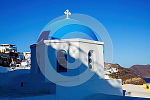Oia church with cupola painted blue, Santorini island in Greece.