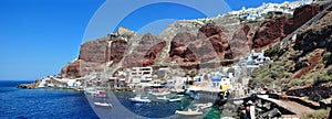 Oia, a panoramic view from the coast of Port Amoudi. The island of Santorini, Greece.