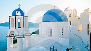 Oia Santorini Greece on a sunny day during summer with whitewashed homes and churches, Greek Island