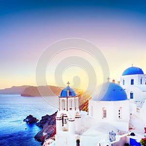 Oia town on Santorini Greece at sunset. Aegean sea