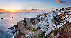 Oia town on Santorini island, Greece at sunset.