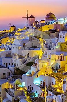 Oia town, Santorini island, Greece at sunset. Traditional and fa