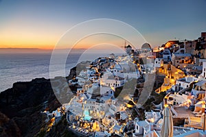 Oia town on Santorini island, Greece at sunset.