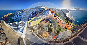 Oia town on Santorini island, Greece. Traditional and famous houses and churches with blue domes over the Caldera.