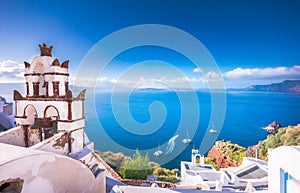 Oia town on Santorini island, Greece. Traditional and famous houses and churches with blue domes over the Caldera, Aegean sea