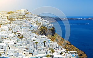 Oia town on Santorini island, Greece. Traditional and famous houses and churches with blue domes over the Caldera, Aegean sea