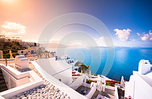 Oia town on Santorini island, Greece. Traditional and famous houses and churches with blue domes over the Caldera, Aegean sea