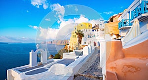 Oia town on Santorini island, Greece. Traditional and famous houses and churches with blue domes over the Caldera.