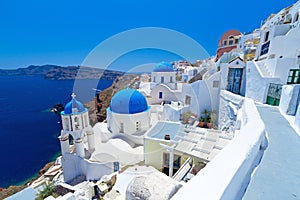 Oia town on Santorini island withe Church Cupolas photo