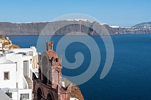 Oia Town in Santorini with  traditional Cycladic houses overlooking the Sea, Greece