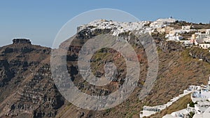 Oia town on volcanic caldera of Santorini island washed by Aegean Sea, panorama