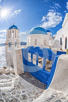 Oia village with churches against azure sea on Santorini island in Greece