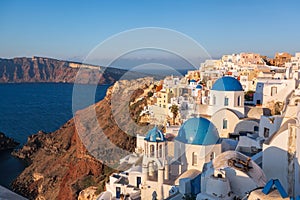 Oia village with churches on Santorini island in Greece