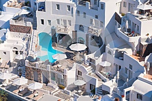 Oia village, Santorini, Greece. Architectural background. View of traditional houses in Santorini. Small narrow streets and roofto